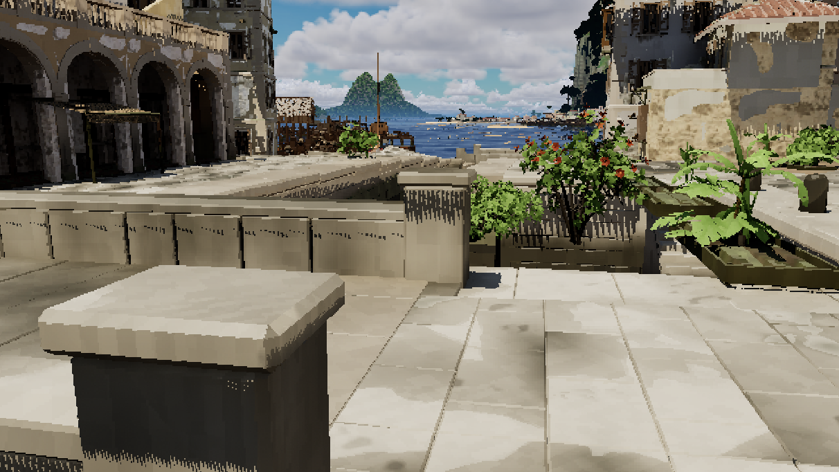 A stone square by the harbour with arcades and a view of the sea