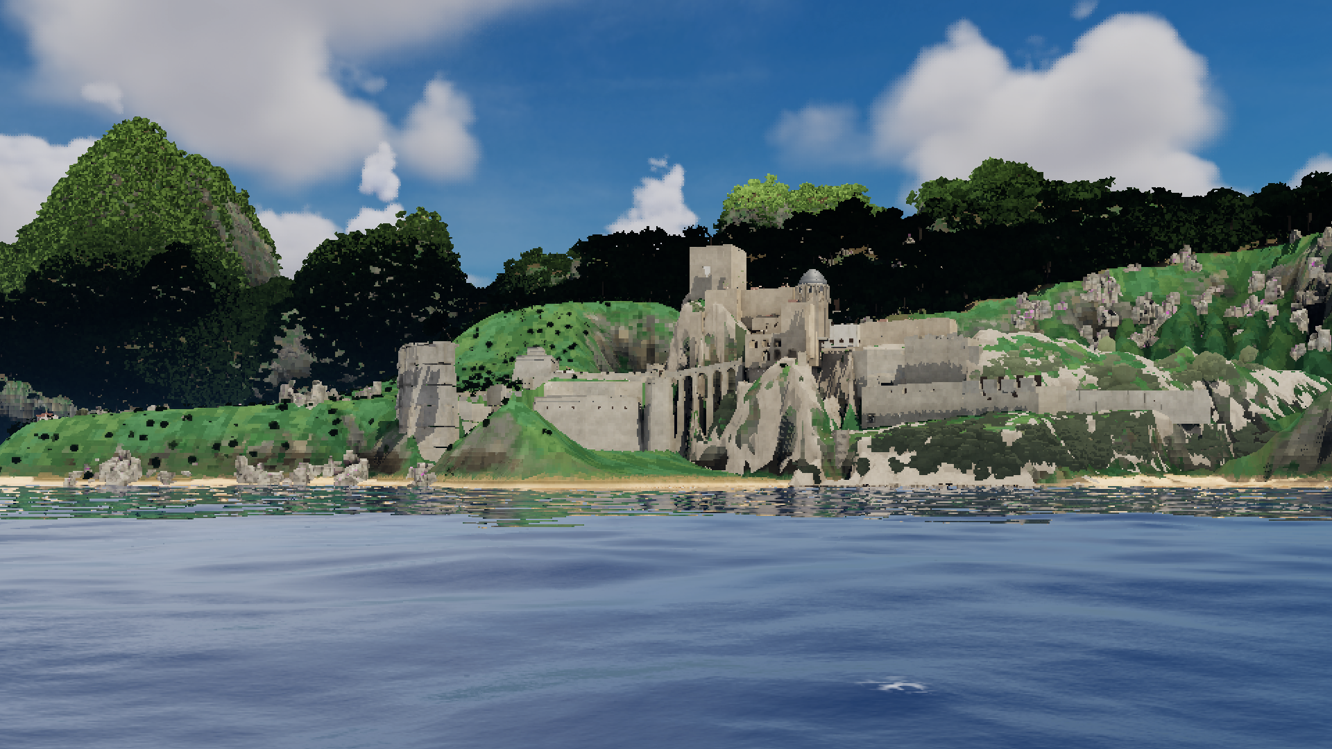 A stone fort above a green headland, seen from the sea